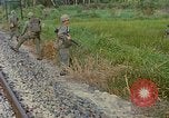 Image of US Army soldiers in field Vietnam, 1968, second 60 stock footage video 65675040364