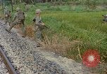 Image of US Army soldiers in field Vietnam, 1968, second 61 stock footage video 65675040364
