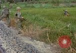 Image of US Army soldiers in field Vietnam, 1968, second 62 stock footage video 65675040364