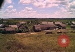 Image of Scenic view of a village Vietnam, 1965, second 33 stock footage video 65675040375