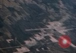Image of strafing Japanese buildings Pacific Theater, 1945, second 10 stock footage video 65675040473
