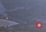 Image of fire in jungle Pacific Theater, 1945, second 4 stock footage video 65675040477