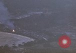 Image of fire in jungle Pacific Theater, 1945, second 5 stock footage video 65675040477