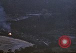 Image of fire in jungle Pacific Theater, 1945, second 7 stock footage video 65675040477