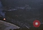 Image of fire in jungle Pacific Theater, 1945, second 9 stock footage video 65675040477