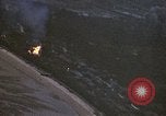 Image of fire in jungle Pacific Theater, 1945, second 14 stock footage video 65675040477