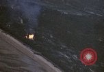 Image of fire in jungle Pacific Theater, 1945, second 15 stock footage video 65675040477