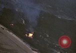 Image of fire in jungle Pacific Theater, 1945, second 16 stock footage video 65675040477