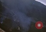 Image of fire in jungle Pacific Theater, 1945, second 17 stock footage video 65675040477