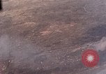 Standbild US-Flugzeuge strafing Ziele auf Okinawa Okinawa Ryukyu Inseln, 1945, aus Sekunde 12 historischem Filmmaterial Videoclip 65675040496