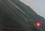Image of U.S. fighter plane strafes lines of communication in Japan during Worl Japan, 1945, second 26 stock footage video 65675040502