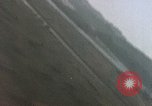 Image of U.S. fighter plane strafes lines of communication in Japan during Worl Japan, 1945, second 27 stock footage video 65675040502