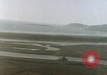 Image of U.S. fighter plane strafes lines of communication in Japan during Worl Japan, 1945, second 32 stock footage video 65675040502