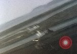 Image of U.S. fighter plane strafes lines of communication in Japan during Worl Japan, 1945, second 34 stock footage video 65675040502