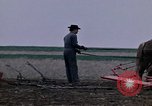 Image of Farmer plowing field New York United States USA, 1970, second 13 stock footage video 65675040534