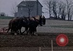 Image of Farmer plowing field New York United States USA, 1970, second 25 stock footage video 65675040534