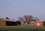 Image of Suburban houses near farm New York United States USA, 1970, second 9 stock footage video 65675040542