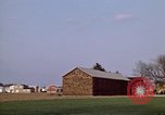 Image of Suburban houses near farm New York United States USA, 1970, second 14 stock footage video 65675040542