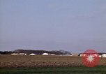 Image of Suburban houses near farm New York United States USA, 1970, second 23 stock footage video 65675040542