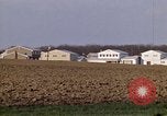 Image of Suburban houses near farm New York United States USA, 1970, second 25 stock footage video 65675040542