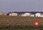 Image of Suburban houses near farm New York United States USA, 1970, second 27 stock footage video 65675040542
