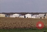 Image of Suburban houses near farm New York United States USA, 1970, second 29 stock footage video 65675040542