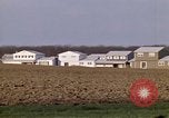 Image of Suburban houses near farm New York United States USA, 1970, second 30 stock footage video 65675040542