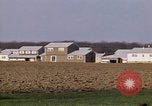 Image of Suburban houses near farm New York United States USA, 1970, second 32 stock footage video 65675040542