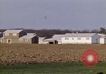 Image of Suburban houses near farm New York United States USA, 1970, second 33 stock footage video 65675040542
