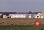 Image of Suburban houses near farm New York United States USA, 1970, second 34 stock footage video 65675040542