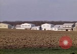 Image of Suburban houses near farm New York United States USA, 1970, second 39 stock footage video 65675040542