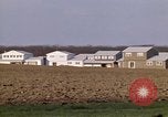 Image of Suburban houses near farm New York United States USA, 1970, second 40 stock footage video 65675040542