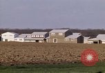 Image of Suburban houses near farm New York United States USA, 1970, second 41 stock footage video 65675040542