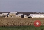 Image of Suburban houses near farm New York United States USA, 1970, second 42 stock footage video 65675040542