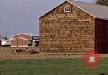 Image of Suburban houses near farm New York United States USA, 1970, second 48 stock footage video 65675040542