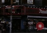 Image of Shops and stores along street of New York City New York City USA, 1970, second 36 stock footage video 65675040546