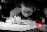 Image of Japanese workers and training of children for war Japan, 1941, second 16 stock footage video 65675040809