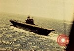 Image of Navy fighter aircraft landing on USS Essex Pacific Theater, 1945, second 10 stock footage video 65675040813