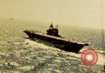 Image of Navy fighter aircraft landing on USS Essex Pacific Theater, 1945, second 11 stock footage video 65675040813