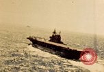 Image of Navy fighter aircraft landing on USS Essex Pacific Theater, 1945, second 14 stock footage video 65675040813