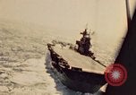 Image of Navy fighter aircraft landing on USS Essex Pacific Theater, 1945, second 28 stock footage video 65675040813