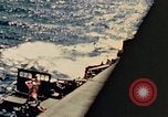 Image of Navy fighter aircraft landing on USS Essex Pacific Theater, 1945, second 30 stock footage video 65675040813