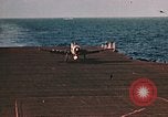 Image of Navy fighter aircraft landing on USS Essex Pacific Theater, 1945, second 32 stock footage video 65675040813