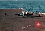 Image of Navy fighter aircraft landing on USS Essex Pacific Theater, 1945, second 52 stock footage video 65675040813
