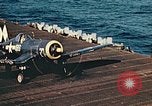 Image of Navy fighter aircraft landing on USS Essex Pacific Theater, 1945, second 54 stock footage video 65675040813