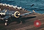 Image of Navy fighter aircraft landing on USS Essex Pacific Theater, 1945, second 55 stock footage video 65675040813