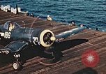 Image of Navy fighter aircraft landing on USS Essex Pacific Theater, 1945, second 56 stock footage video 65675040813