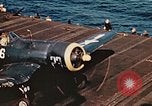 Image of Navy fighter aircraft landing on USS Essex Pacific Theater, 1945, second 57 stock footage video 65675040813