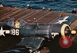 Image of Navy fighter aircraft landing on USS Essex Pacific Theater, 1945, second 58 stock footage video 65675040813
