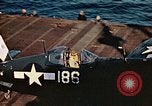 Image of Navy fighter aircraft landing on USS Essex Pacific Theater, 1945, second 59 stock footage video 65675040813